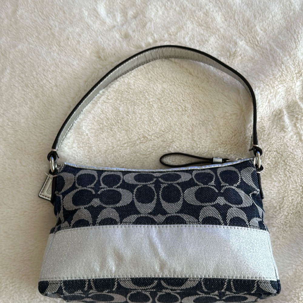 I am selling a coach mini bag, real coach, black and silver